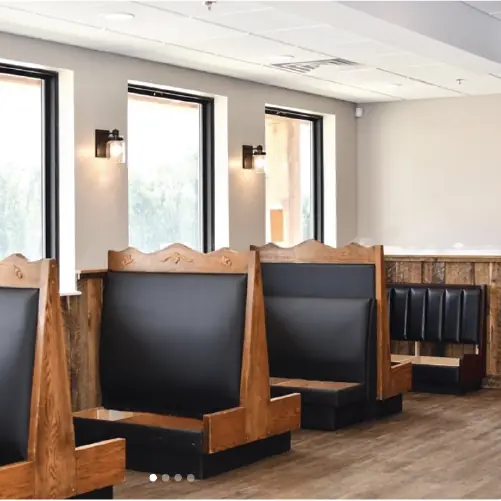 Dining room with wooden booths and big windows