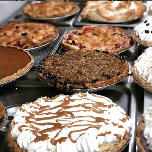 Several homemade cream and fruit pies